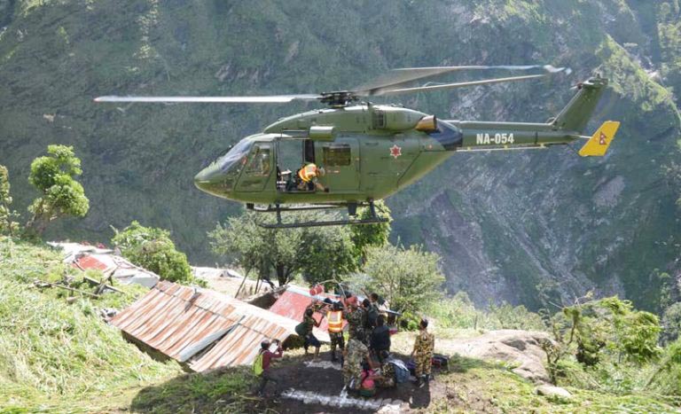 Nepal Army helicopter airlifting landslide victims in Dhading
